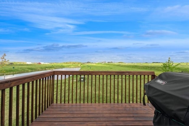 deck featuring a yard and a grill