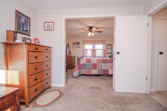 bedroom with ornamental molding, light carpet, and baseboards