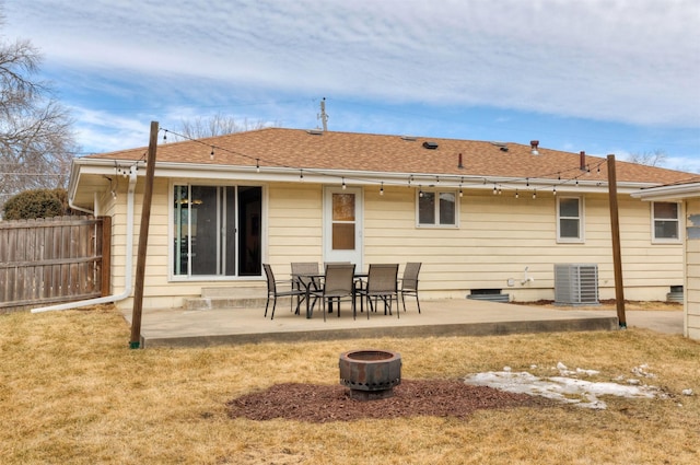 back of house featuring a shingled roof, fence, a patio, and central air condition unit