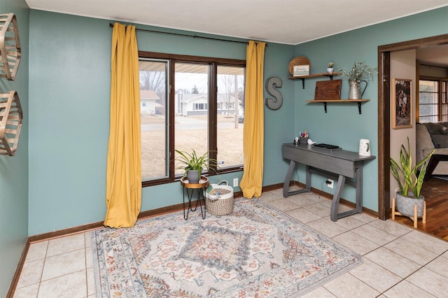 interior space featuring tile patterned flooring and baseboards