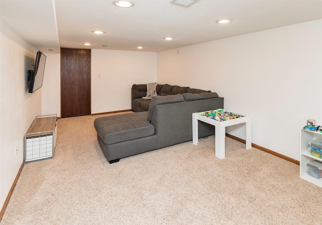 carpeted living room featuring recessed lighting, visible vents, and baseboards