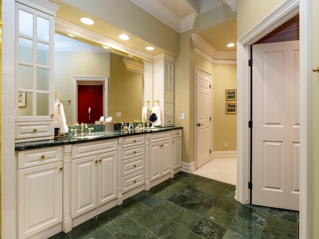 full bathroom with baseboards, vanity, and crown molding