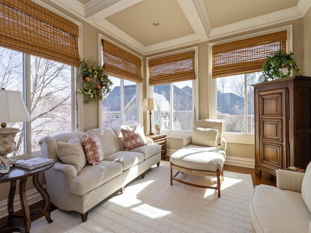 sunroom with beamed ceiling, coffered ceiling, and a mountain view