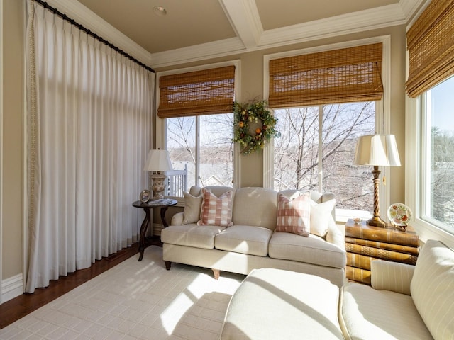 sunroom with beam ceiling and a healthy amount of sunlight