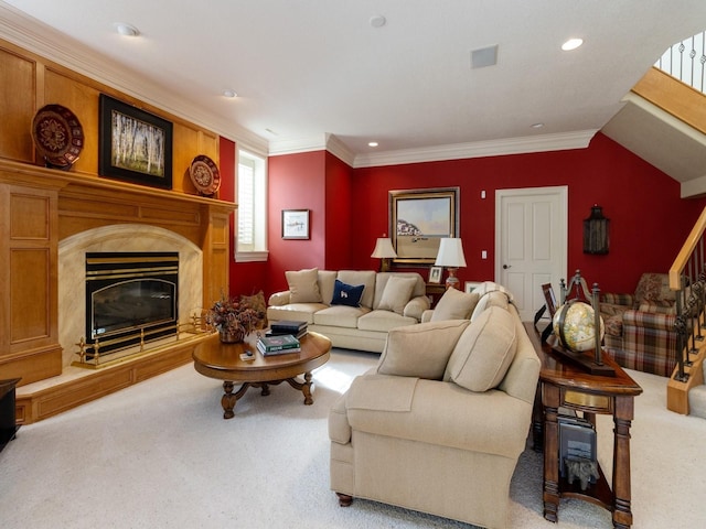 carpeted living area featuring stairway, a premium fireplace, recessed lighting, and crown molding