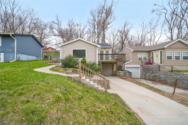 view of front of house featuring driveway, a garage, stairway, and a front yard