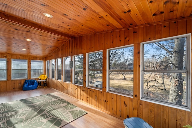 unfurnished sunroom with wooden ceiling and vaulted ceiling