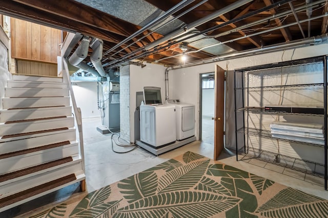 6015 Waterbury Cir, Des Moines, IA 50312 - unfinished below grade area with washing machine and clothes dryer, stairway, and heating unit