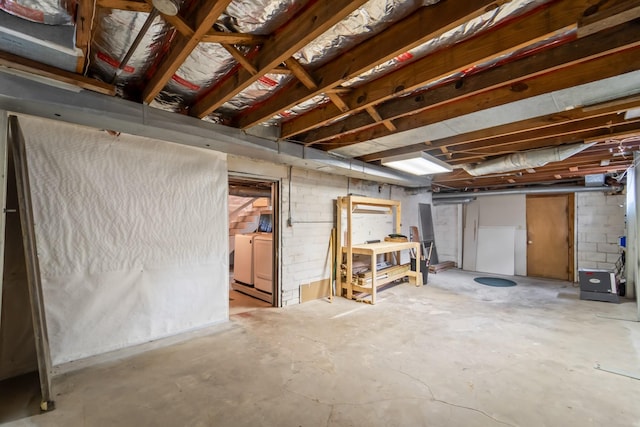 6015 Waterbury Cir, Des Moines, IA 50312 - unfinished basement featuring washer and clothes dryer