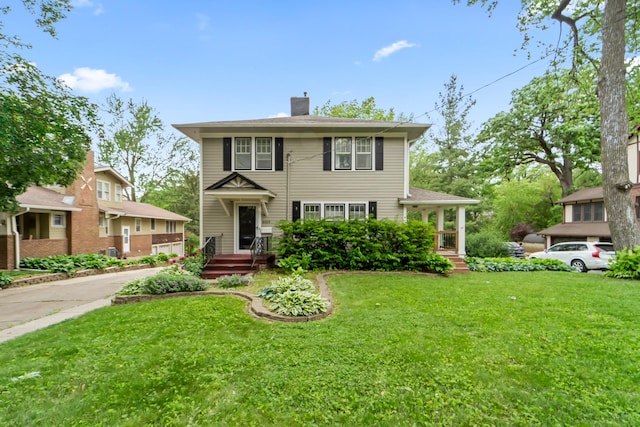 6015 Waterbury Cir, Des Moines, IA 50312 - view of front of property featuring a front lawn and a chimney
