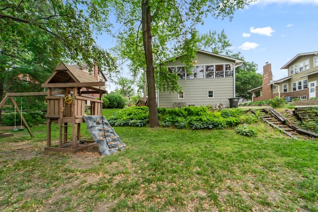 6015 Waterbury Cir, Des Moines, IA 50312 - view of green lawn with a playground