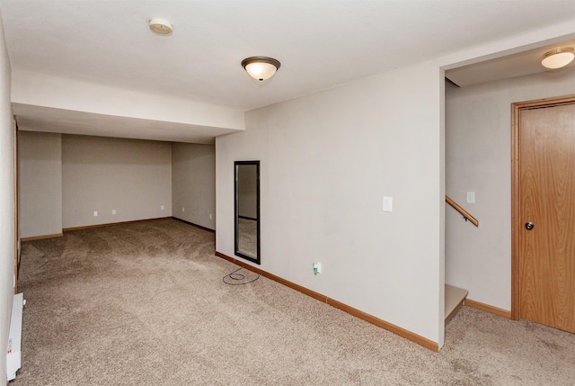 finished below grade area featuring carpet floors and baseboards