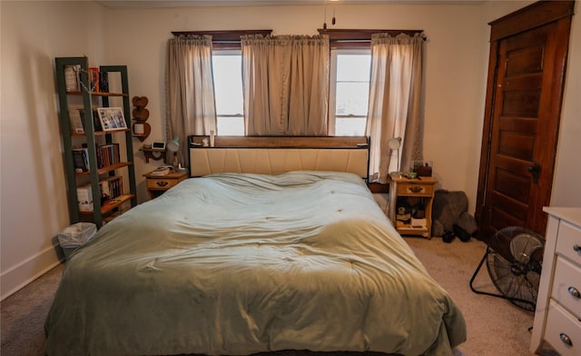 carpeted bedroom with baseboards