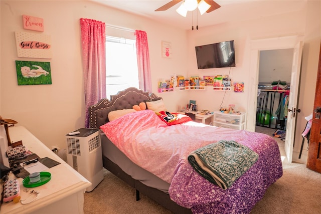 bedroom with light colored carpet and ceiling fan