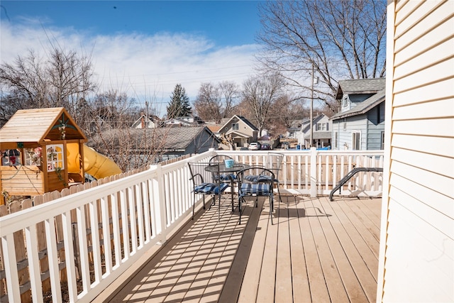 deck featuring a residential view and a playground