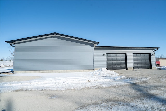 view of snow covered garage