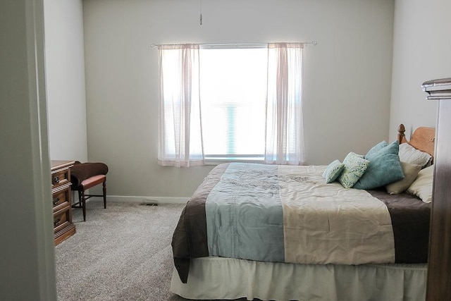 bedroom with carpet and baseboards