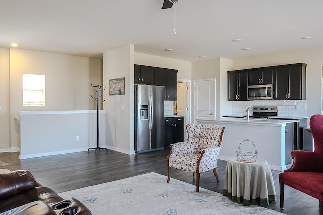 living room with dark wood-style floors and baseboards