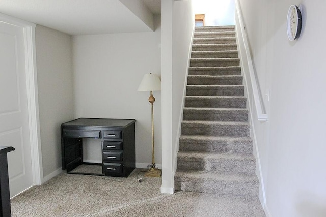 staircase with carpet and baseboards