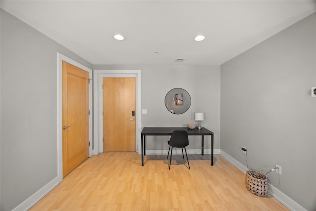 office space featuring visible vents, baseboards, wood finished floors, and recessed lighting