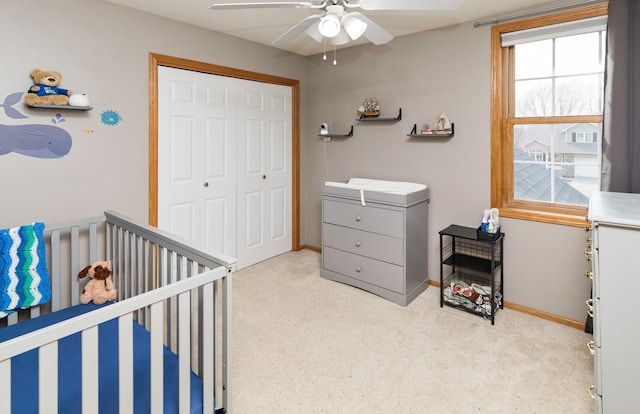 bedroom featuring a closet, ceiling fan, and baseboards