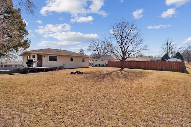 view of yard featuring fence and a wooden deck