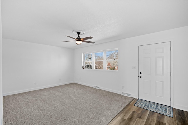 entrance foyer with visible vents, ceiling fan, and baseboards