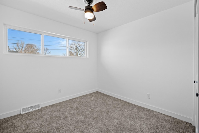 unfurnished room featuring visible vents, carpet flooring, baseboards, and ceiling fan