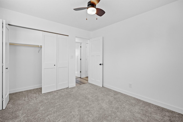 unfurnished bedroom with a closet, ceiling fan, baseboards, and carpet