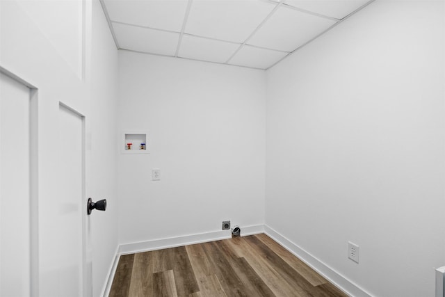 laundry room featuring electric dryer hookup, washer hookup, dark wood finished floors, baseboards, and laundry area