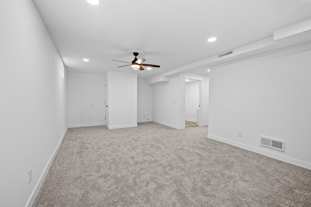 spare room with light colored carpet, recessed lighting, visible vents, and a ceiling fan