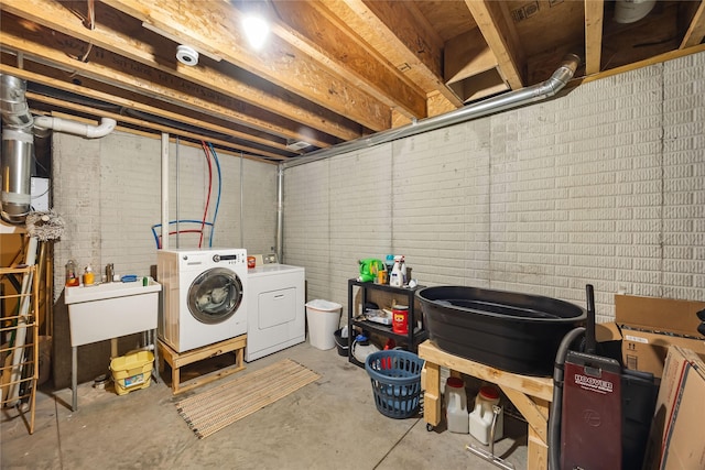 unfinished basement with washing machine and dryer