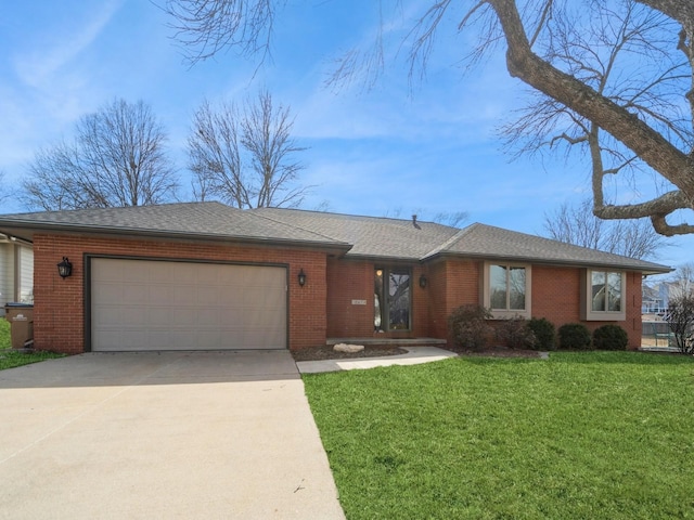 ranch-style house with an attached garage, brick siding, a shingled roof, concrete driveway, and a front yard