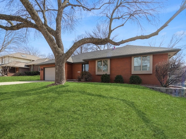 single story home featuring a garage, a shingled roof, concrete driveway, a front lawn, and brick siding