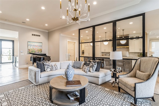 living area featuring crown molding, baseboards, visible vents, and recessed lighting