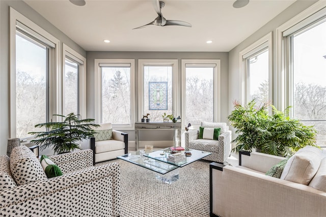 sunroom with ceiling fan and a wealth of natural light