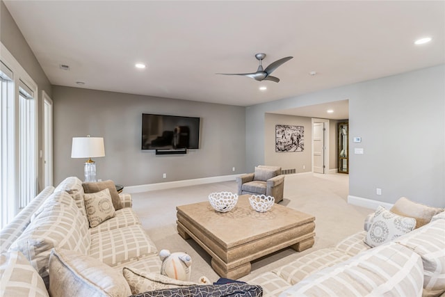 living area with recessed lighting, baseboards, a ceiling fan, and light colored carpet