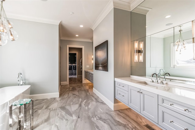 full bath featuring baseboards, a soaking tub, marble finish floor, crown molding, and vanity