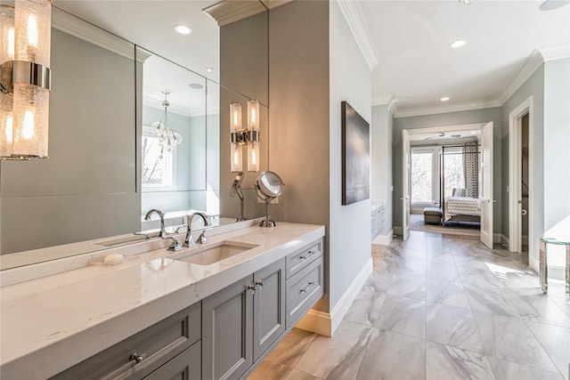 ensuite bathroom featuring ensuite bathroom, recessed lighting, vanity, baseboards, and crown molding