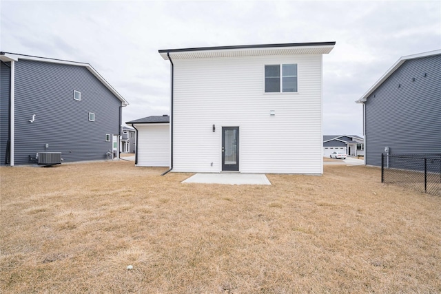 rear view of property featuring a patio, fence, cooling unit, and a yard