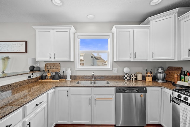 kitchen featuring a sink, white cabinetry, and stainless steel appliances