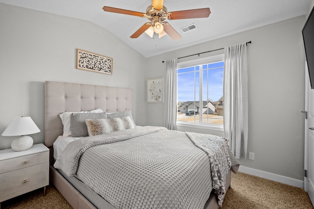 bedroom with visible vents, ceiling fan, baseboards, vaulted ceiling, and carpet flooring