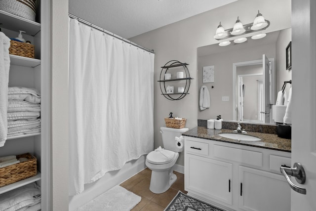 bathroom with shower / bathtub combination with curtain, toilet, a textured ceiling, tile patterned flooring, and vanity