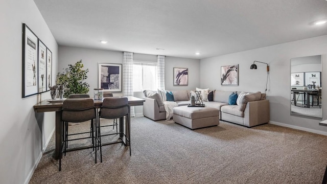 living area featuring recessed lighting, carpet flooring, and baseboards