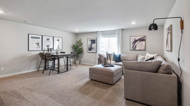 carpeted living room featuring recessed lighting, visible vents, and baseboards