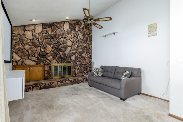 living room featuring a fireplace, a ceiling fan, baseboards, vaulted ceiling, and carpet