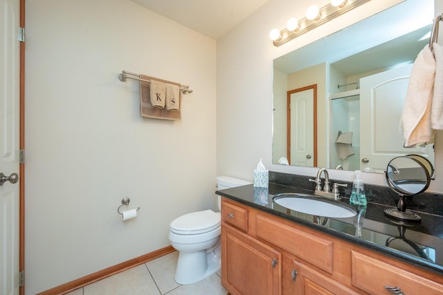 full bathroom with baseboards, toilet, a shower with door, tile patterned flooring, and vanity