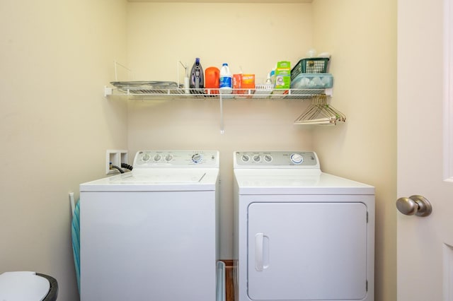 clothes washing area featuring laundry area and washing machine and dryer