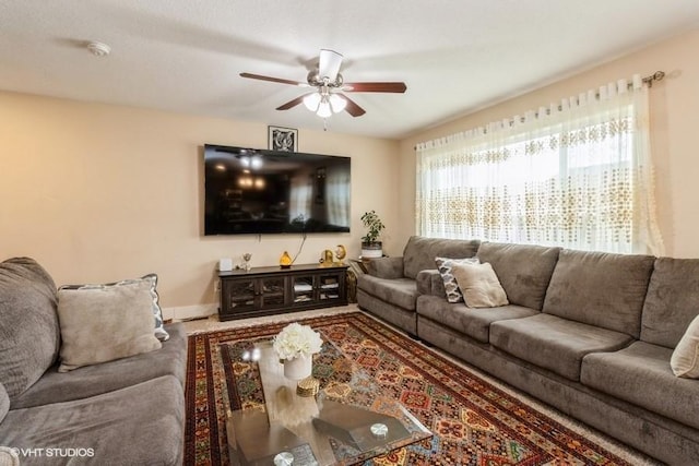 living room featuring a ceiling fan