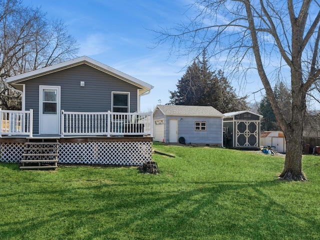 back of property featuring a storage shed, a yard, an outdoor structure, and a wooden deck